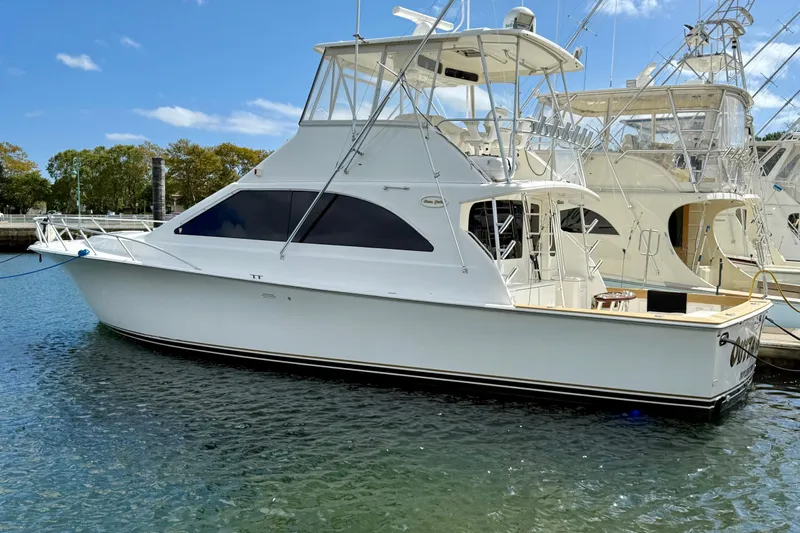  Yacht Photos Pics 2000 Ocean Yachts 48 model docked in a marina under a clear blue sky.
