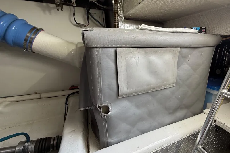  Yacht Photos Pics Engine room of a 2000 Ocean Yachts 48, featuring insulated components and piping.