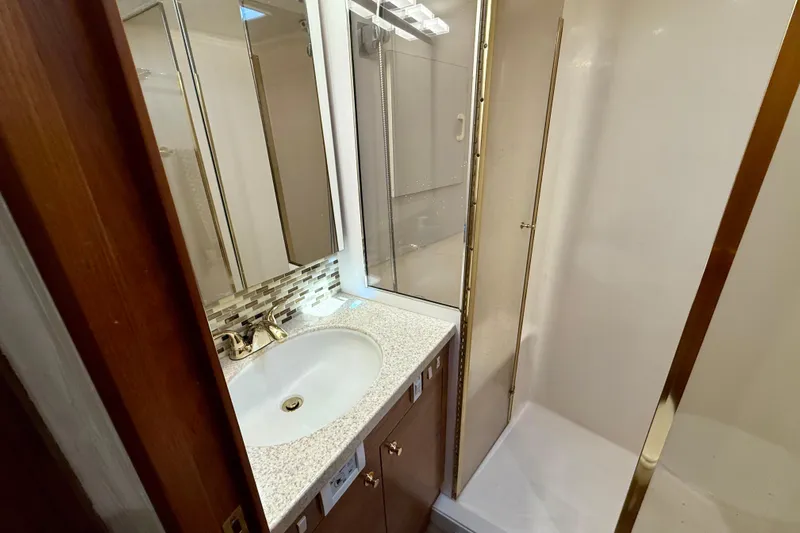  Yacht Photos Pics Bathroom interior of 2000 Ocean Yachts 48, featuring sink and shower.
