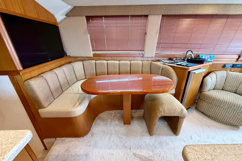  Yacht Photos Pics Luxurious interior of a 2000 Ocean Yachts 48, featuring a cozy dining area and modern amenities.