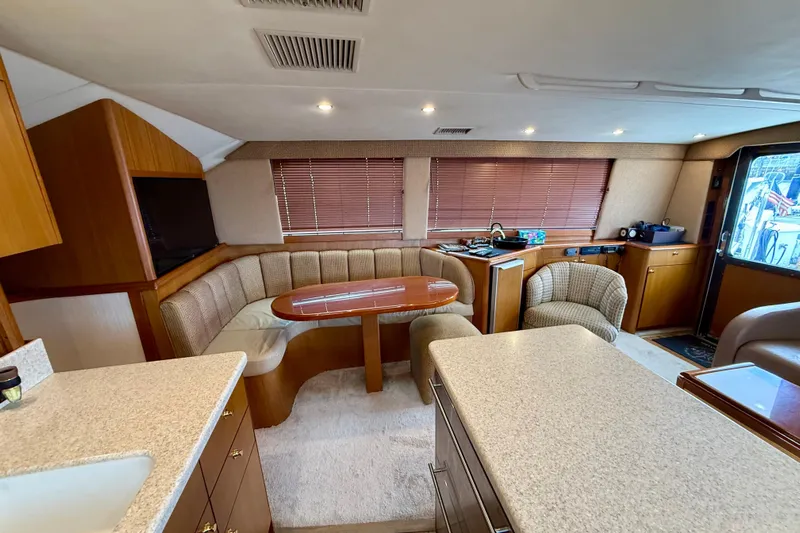  Yacht Photos Pics Luxurious interior of a 2000 Ocean Yachts 48, featuring a cozy dining area and modern amenities.