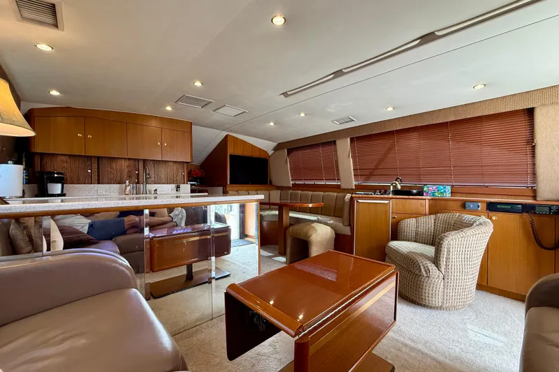  Yacht Photos Pics Luxurious interior of a 2000 Ocean Yachts 48, featuring elegant wood finishes and comfortable seating.
