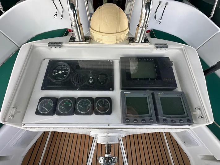 Knot Inspired Yacht Photos Pics Control panel of a 2002 Beneteau 411 sailboat with navigation instruments.