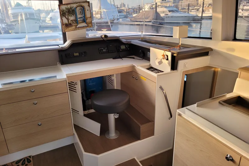  Yacht Photos Pics Interior of a 2019 Bali 4.3 yacht with modern navigation station and marina view.