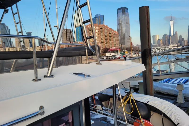  Yacht Photos Pics Bali 4.3 catamaran docked with city skyline in the background, 2019 model.