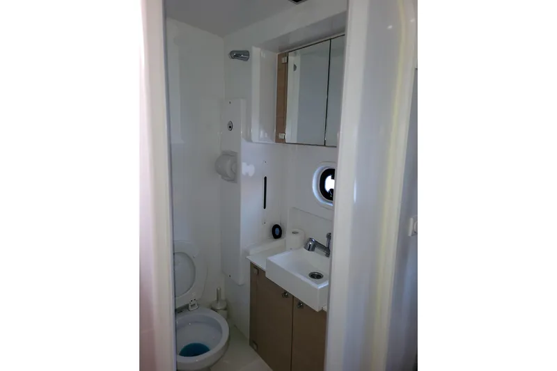  Yacht Photos Pics Compact bathroom in a 2019 Bali 4.3 model yacht, featuring a toilet and sink.