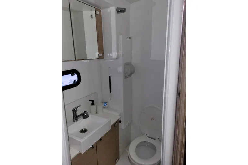  Yacht Photos Pics Compact bathroom in 2019 Bali 4.3 model yacht with sink, mirror, and toilet.