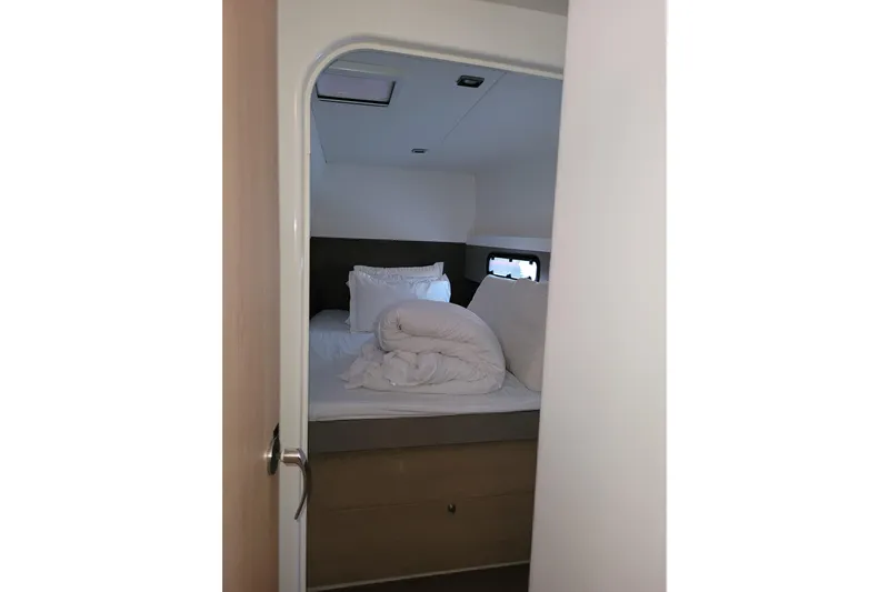  Yacht Photos Pics Cozy cabin bedroom in 2019 Bali 4.3 yacht with neatly arranged bedding.