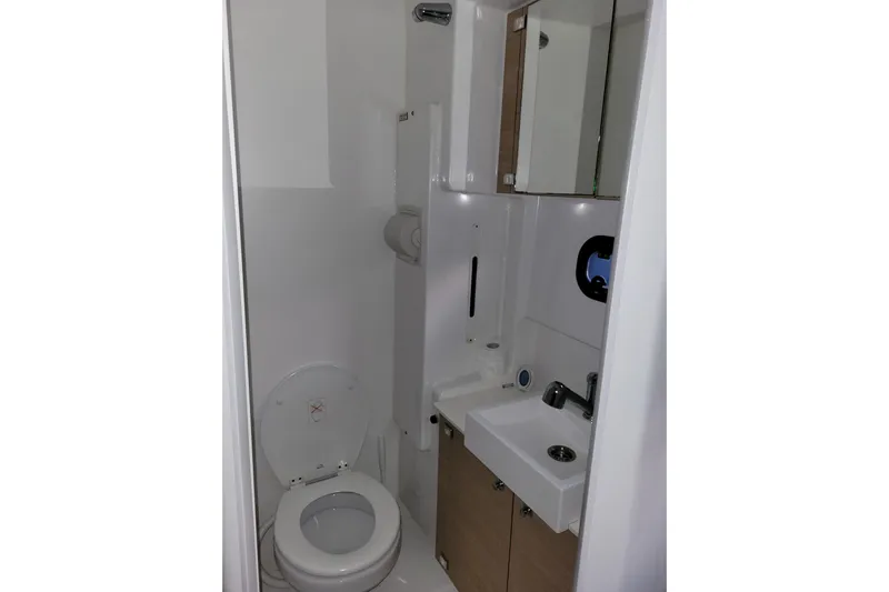  Yacht Photos Pics Compact bathroom in 2019 Bali 4.3 model yacht with toilet, sink, and storage.