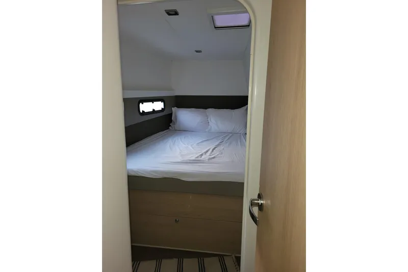 Yacht Photos Pics Cozy cabin bedroom in 2019 Bali 4.3 yacht with window and bedding.