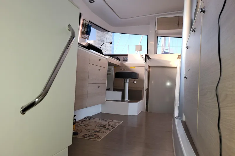  Yacht Photos Pics Interior of a 2019 Bali 4.3 catamaran, featuring modern cabinetry and seating.