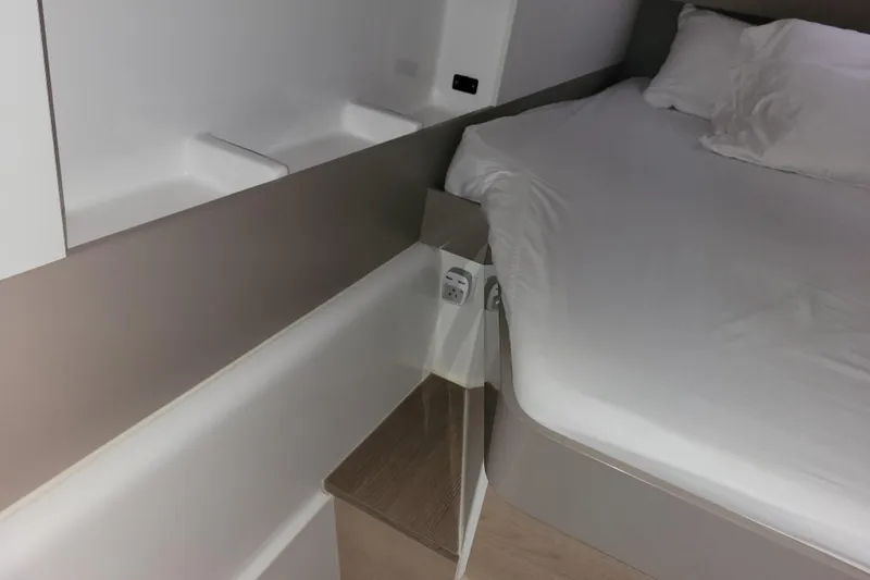  Yacht Photos Pics Interior cabin of a 2019 Bali 4.3 yacht with a neatly made bed.