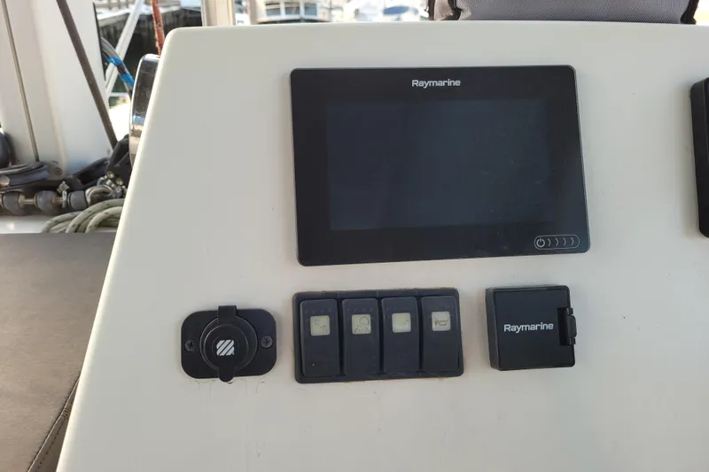  Yacht Photos Pics Control panel of a 2019 Bali 4.3 catamaran with Raymarine display and switches.
