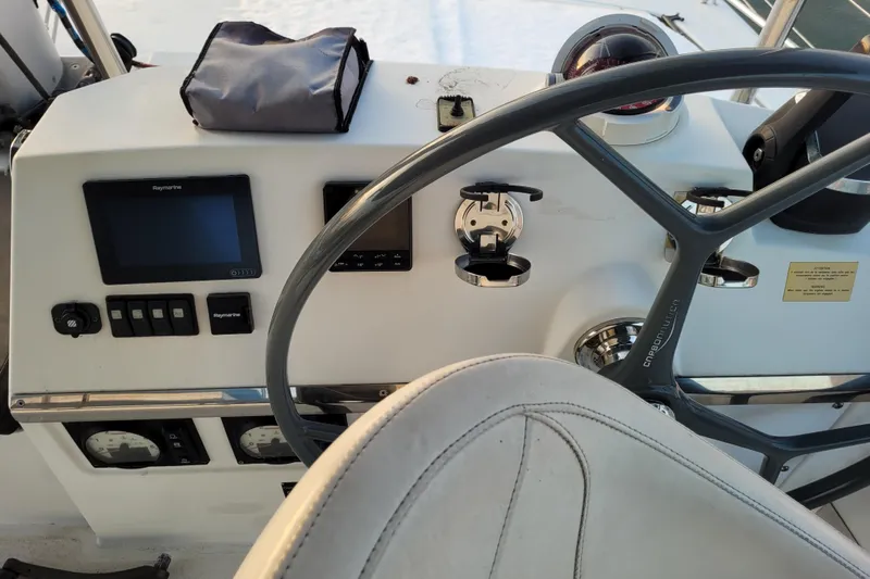  Yacht Photos Pics Steering console of a 2019 Bali 4.3 catamaran with navigation equipment.