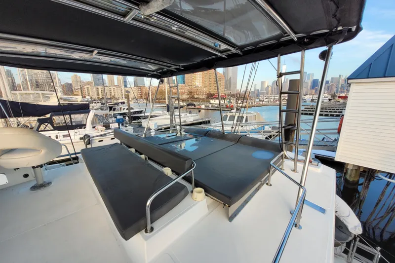  Yacht Photos Pics Luxurious 2019 Bali 4.3 catamaran with spacious deck, docked in a scenic marina.