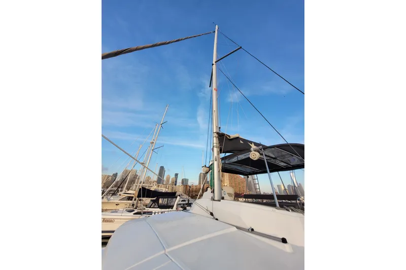  Yacht Photos Pics 2019 Bali 4.3 catamaran docked at marina with city skyline in background.