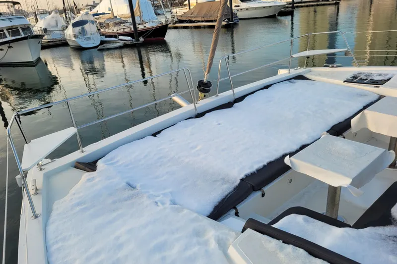  Yacht Photos Pics Snow-covered deck of a 2019 Bali 4.3 catamaran in a marina.