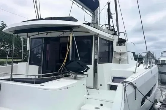  Yacht Photos Pics 2019 Bali 4.3 catamaran docked, featuring spacious deck and modern design.