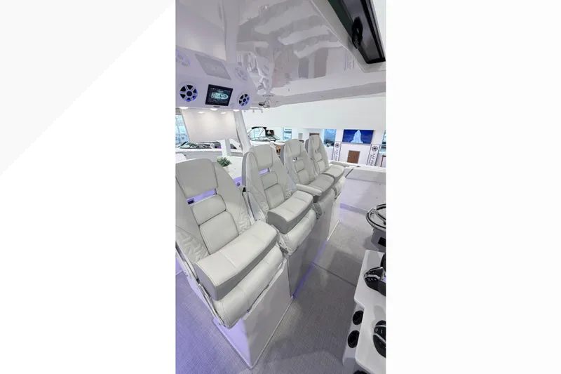  Yacht Photos Pics Luxurious interior seating of 2026 Regal 38 SAV boat, featuring plush white seats and modern design.