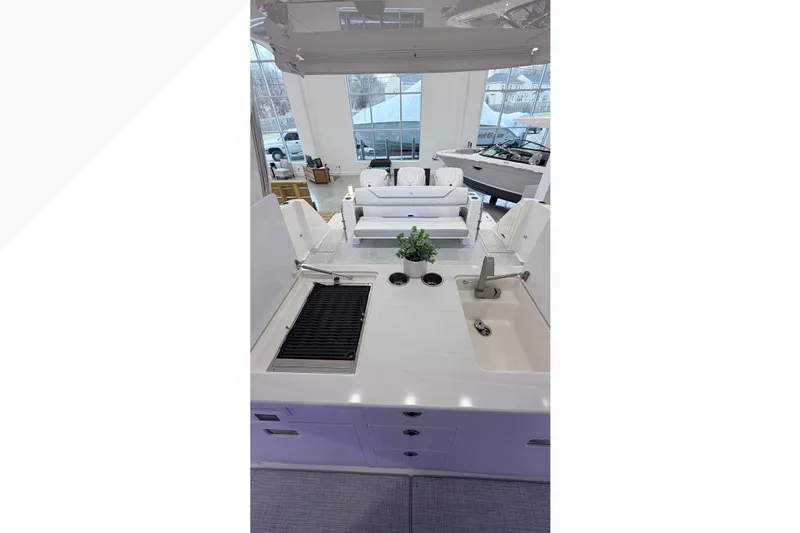  Yacht Photos Pics Luxurious interior of 2026 Regal 38 SAV yacht with modern kitchen and seating area.