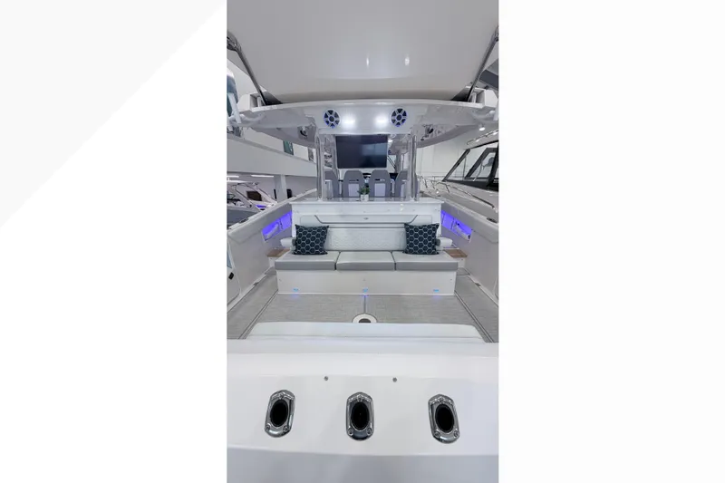  Yacht Photos Pics 2026 Regal 38 SAV luxury boat interior with modern seating and ambient lighting.