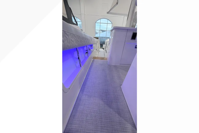  Yacht Photos Pics 2026 Regal 38 SAV interior with modern design and ambient blue lighting.
