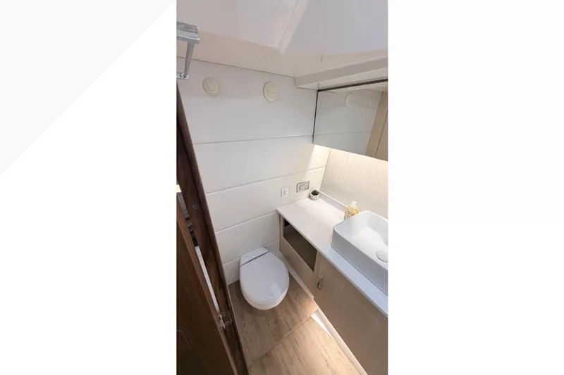  Yacht Photos Pics Modern bathroom interior of 2026 Regal 38 SAV yacht, featuring sleek design and fixtures.