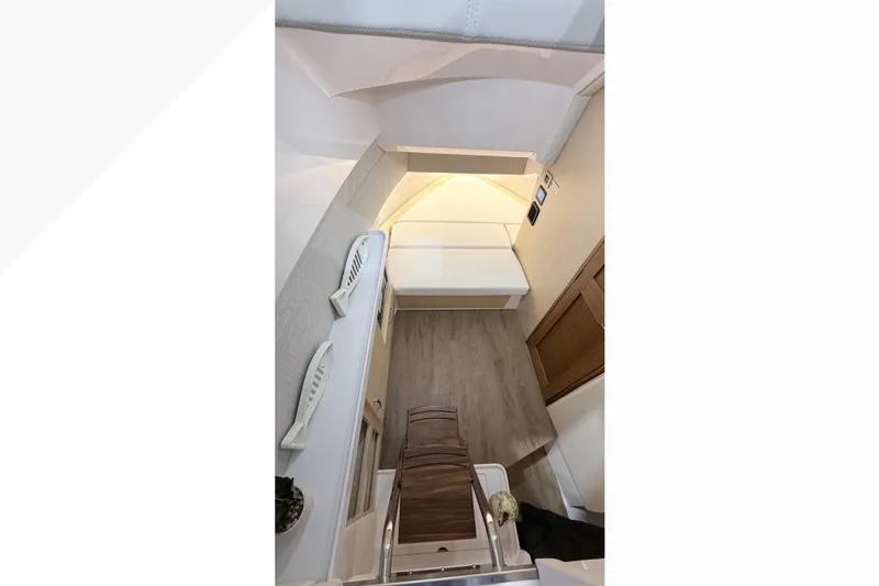  Yacht Photos Pics Interior view of 2026 Regal 38 SAV boat cabin with modern design and wood flooring.