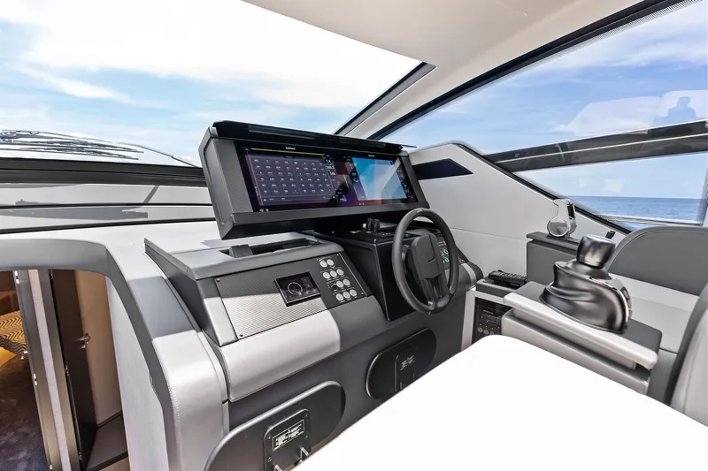  Yacht Photos Pics 2024 Pershing 6X yacht cockpit with modern navigation system and sleek design.