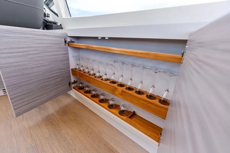  Yacht Photos Pics Open cabinet with glassware storage on 2024 Pershing 6X yacht.