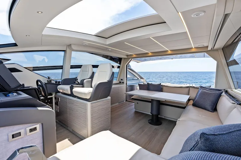  Yacht Photos Pics Luxurious interior of 2024 Pershing 6X yacht with ocean view and modern seating.
