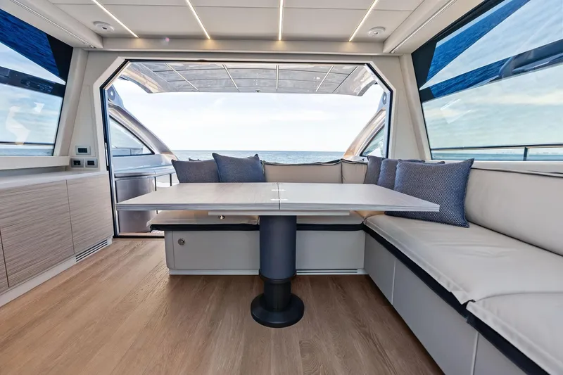  Yacht Photos Pics Luxurious interior of 2024 Pershing 6X yacht with ocean view and modern seating.