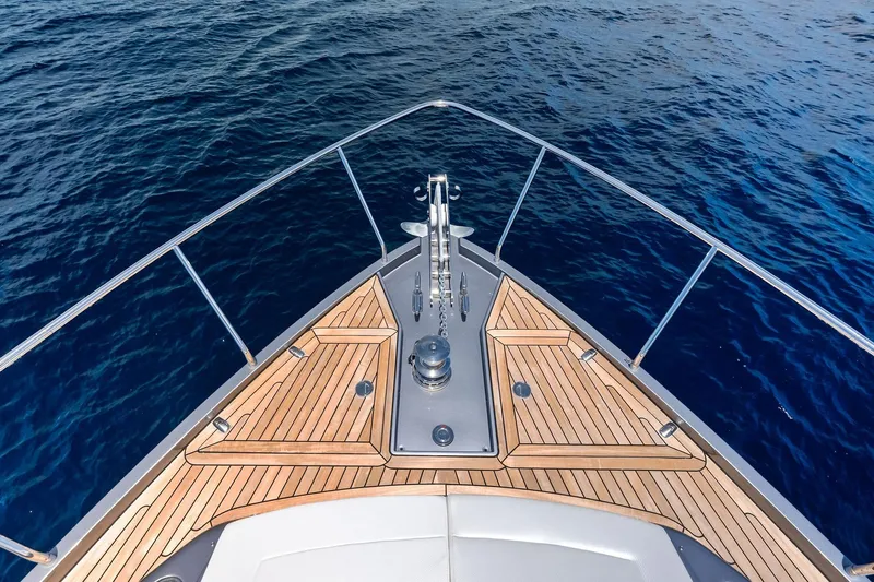  Yacht Photos Pics Bow of 2024 Pershing 6X yacht with teak decking on open water.
