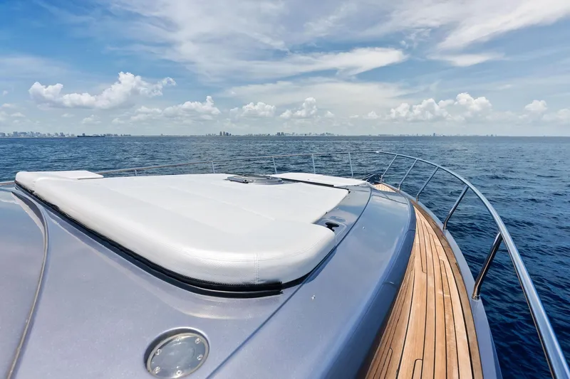  Yacht Photos Pics 2024 Pershing 6X yacht deck with ocean view and city skyline.