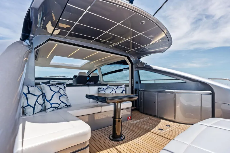  Yacht Photos Pics Luxurious 2024 Pershing 6X yacht interior with sleek design and comfortable seating.