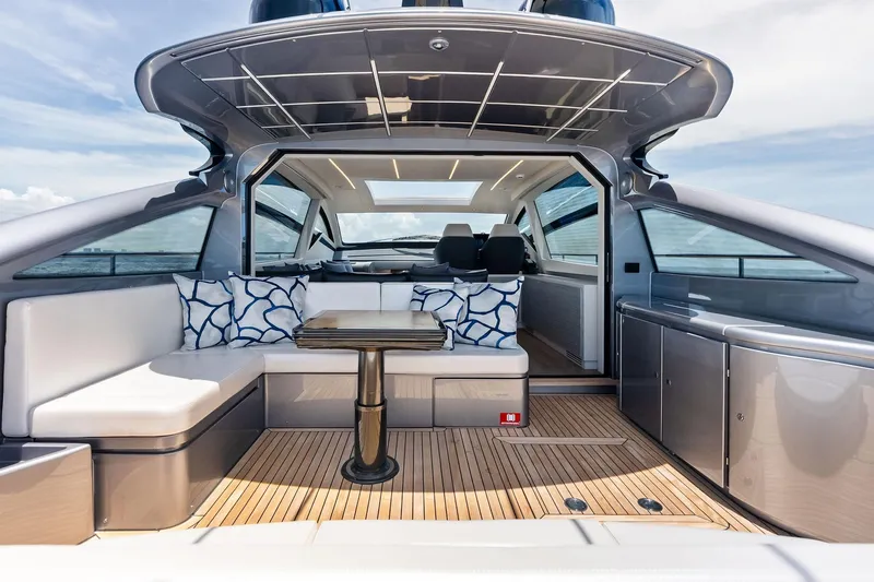  Yacht Photos Pics Luxurious 2024 Pershing 6X yacht interior with modern seating and elegant design.