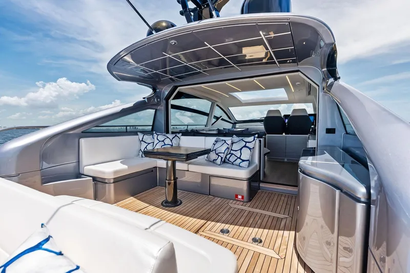  Yacht Photos Pics Luxurious 2024 Pershing 6X yacht interior with sleek seating and modern design.