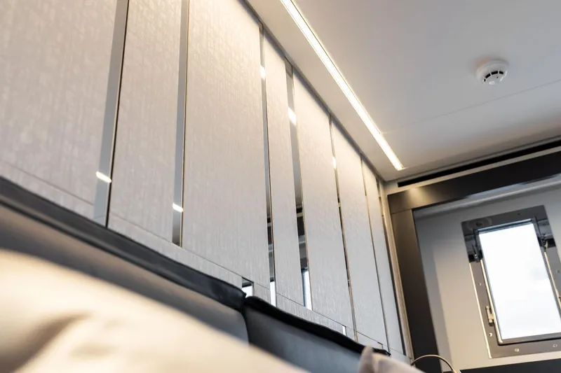  Yacht Photos Pics 2024 Pershing 6X yacht interior with sleek modern design and ambient lighting.