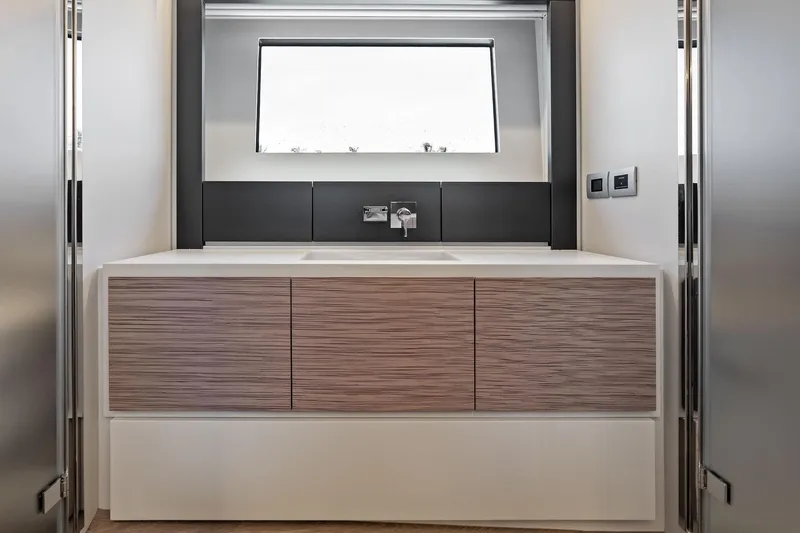  Yacht Photos Pics Modern bathroom vanity in 2024 Pershing 6X yacht, featuring sleek design and minimalist aesthetics.
