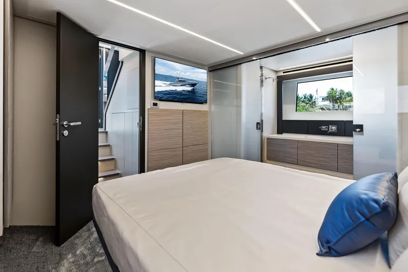  Yacht Photos Pics Luxurious 2024 Pershing 6X yacht interior with modern bedroom and sleek design elements.