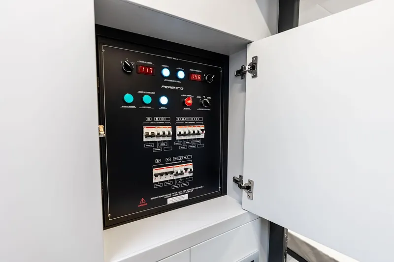  Yacht Photos Pics Electrical control panel inside 2024 Pershing 6X yacht, featuring switches and indicators.