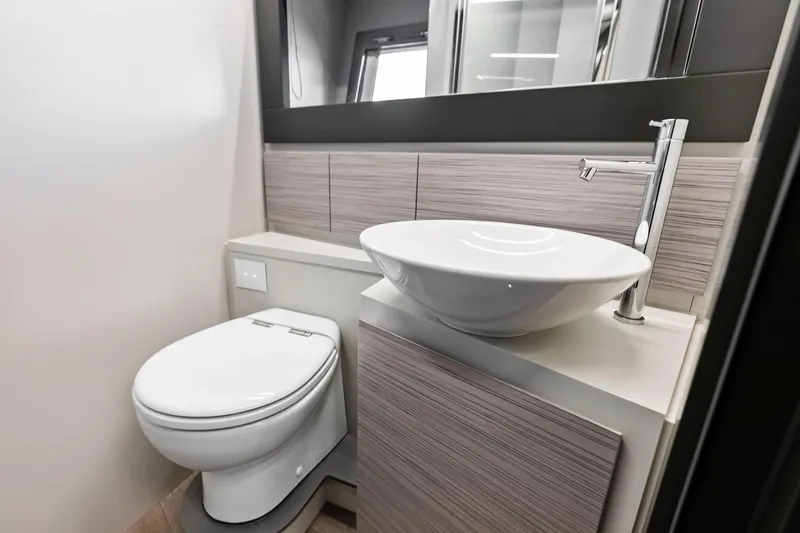  Yacht Photos Pics Modern bathroom in 2024 Pershing 6X yacht with sleek sink and toilet design.