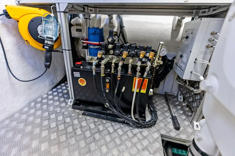  Yacht Photos Pics Engine room of 2024 Pershing 6X yacht with hydraulic system and control panel.