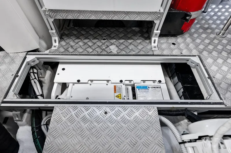  Yacht Photos Pics Engine compartment of 2024 Pershing 6X yacht with visible machinery and wiring.