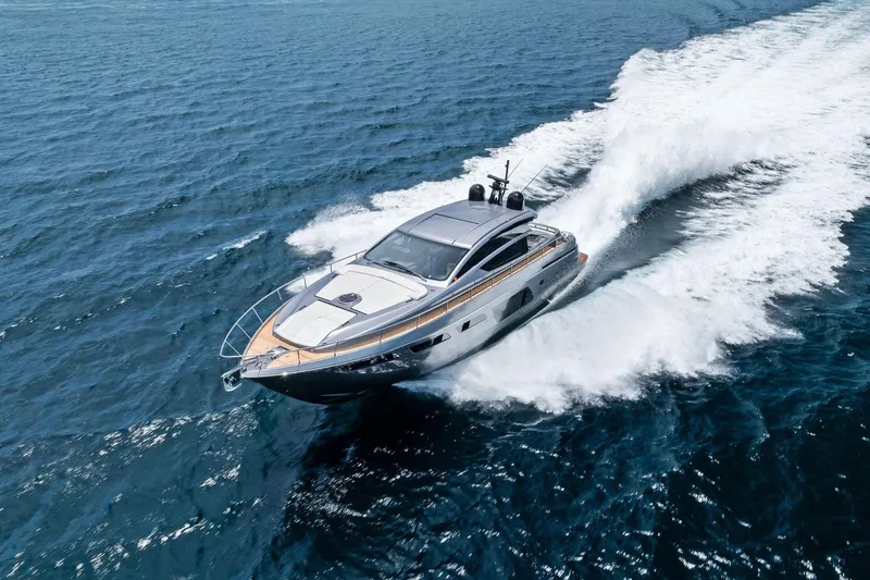  Yacht Photos Pics 2024 Pershing 6X yacht cruising swiftly on open water.