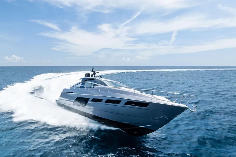  Yacht Photos Pics 2024 Pershing 6X yacht cruising swiftly on open ocean waters.