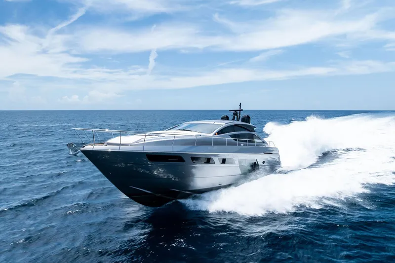  Yacht Photos Pics 2024 Pershing 6X yacht cruising on open sea under clear blue sky.