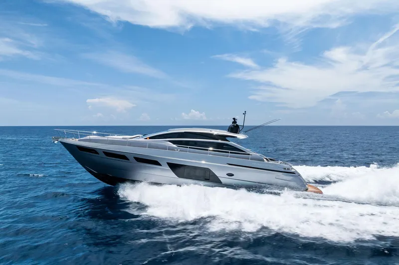  Yacht Photos Pics 2024 Pershing 6X yacht cruising on open sea under clear blue sky.