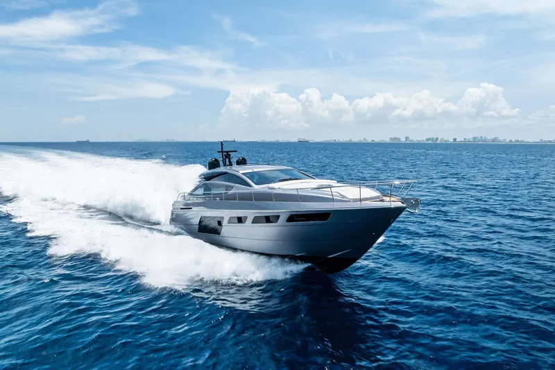  Yacht Photos Pics 2024 Pershing 6X yacht cruising on open sea under clear blue sky.