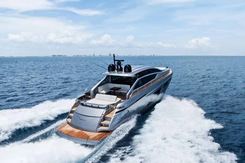  Yacht Photos Pics 2024 Pershing 6X yacht cruising on open sea under clear blue sky.